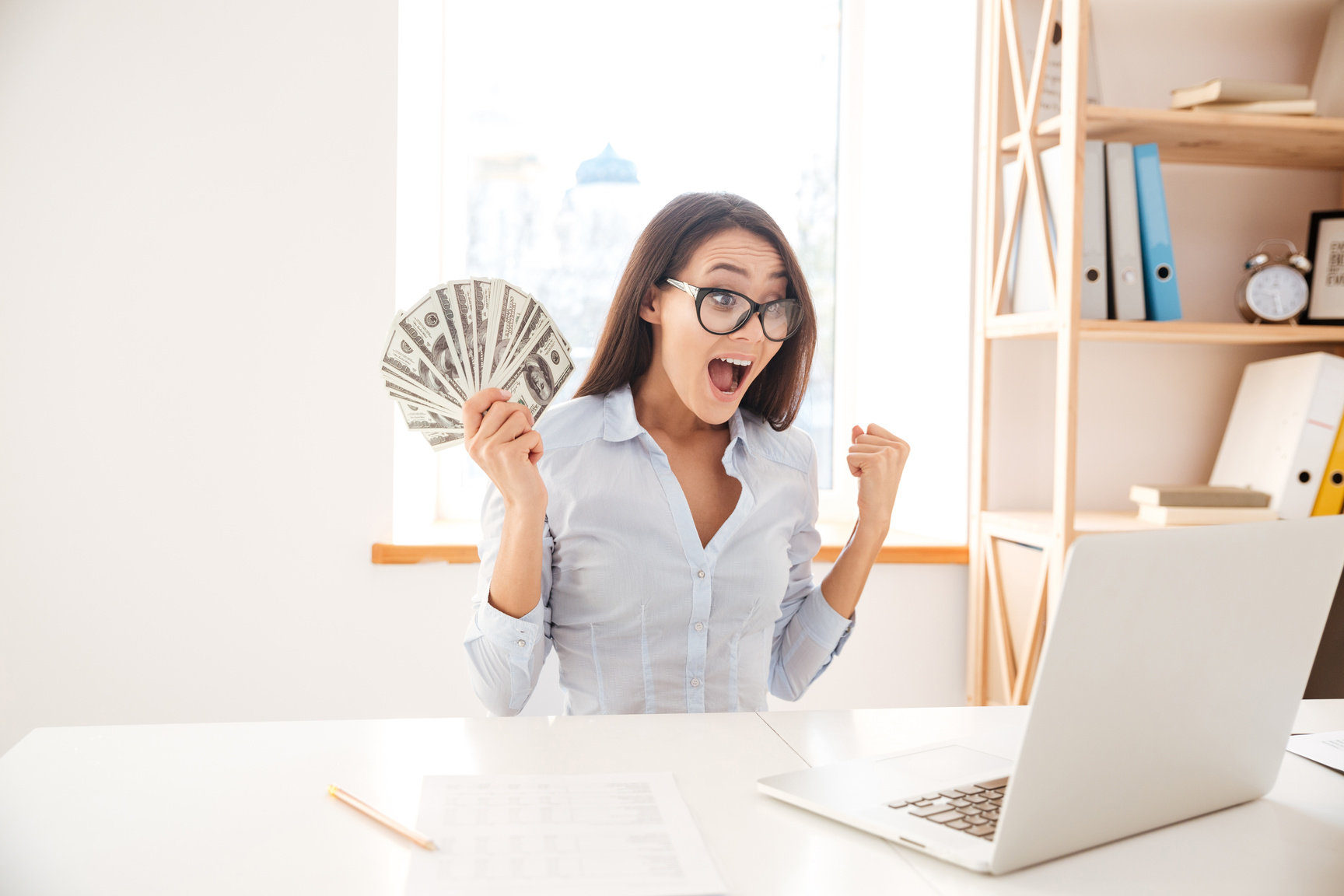 Woman Holding Money in Hand